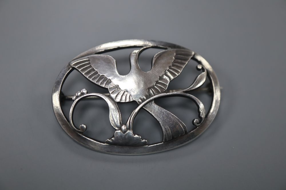 A Georg Jensen sterling Bird of Paradise oval brooch, designed by Arno Malinowski, no. 238, 44mm, 10 grams.